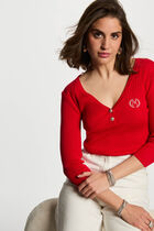 Pull col en V côtelé rouge femme
