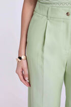 High-waisted carrot trousers pastel green women